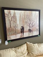 Main photo of the framed street scene artwork hung on wall above couch showing overall look and colors.