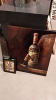 Canvas painting showing wine bottle and corkscrew on a brown background