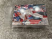 Image of a clear plastic bag filled with baseball cards. The top card shows Ryan Zimmerman in a Washington Nationals uniform in an action pose.
