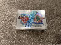 Stack of NBA basketball trading cards featuring a holographic rookie card of Gordon Hayward on top, packed neatly in plastic sleeves.