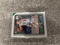 Stack of NBA basketball cards with Payton Pritchard rookie card visible on top