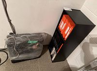 Overview showing taped-down recorder unit and storage cabinet with tapes