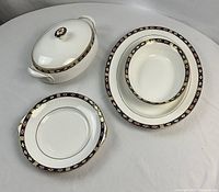 Overview of all four Royal Crown Derby Kedleston serving pieces on white background