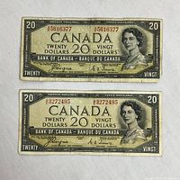 Two banknotes face side showing obverse design, red AE prefixes, serial numbers and Queen portrait.