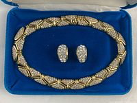 Complete necklace and earrings set in blue velvet-lined Birks box