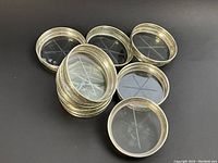 Group of coasters overlapping on black background