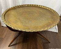 Assembled table at side angle showing tray top and base