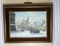 Full front view of the framed oil painting and attached picture light