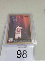 Front side of 1990 SkyBox #41 Michael Jordan basketball card showing dunk action and Bulls logo