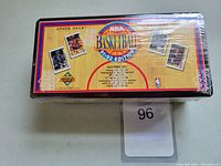 Top view of factory sealed unopened box set for 1991-92 Upper Deck NBA Basketball cards with visible branding and sample card images.