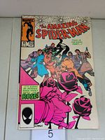 Front cover of Amazing Spider-Man #253 collectible comic book, showing cover art with character named Rose and Spider-Man.