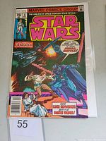 Front cover photo of Star Wars #6 comic book showing Luke Skywalker battling Darth Vader with Princess Leia at the bottom, bright colorful artwork, 35 cent price and Marvel Comics header at top.