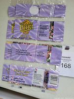 Photo showing three sealed retail jumbo rack packs of 1994/95 Fleer Ultra Series II NBA basketball cards with packaging details and auction lot number.