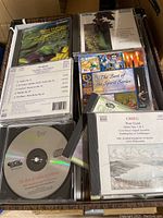 Bankers box filled with classical music CDs, some titles visible including Spirit Series and Grieg Peer Gynt.