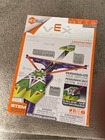 Photo of sealed Hexbug VE Robotics Paper Airplane Launcher box showing colorful packaging and features of the toy.
