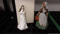 Both Royal Doulton figurines shown side by side with packaging box