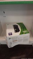 Original retail box of Xbox 360 showing 250GB hard drive branding.