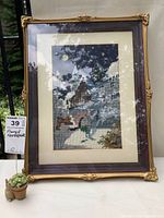 Full view of the framed needlepoint artwork showing the detailed ornate gilded frame and starry night needlepoint scene.
