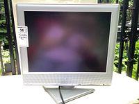 Front view of Toshiba 20-inch LCD TV on a swivel base with visible branding and model sticker.