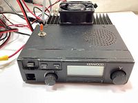 Front view of the Kenwood TK-805 transceiver showing the front panel controls and display.