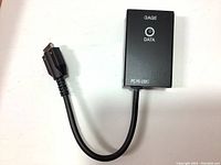 Front view of the black labeled Mitutoyo input tool with RS-232C connector cable, showing 'GAGE', 'DATA' LED indicators, and model labeling.