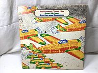 Front cover of 1973 Rod Stewart / Faces LP album featuring stylized airplanes artwork and album title in the top center.