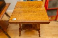 Top view of antique wooden side table showing square top surface and wood grain