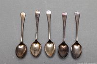 Five 4-inch sterling silver coffee/espresso spoons shown front side with minor tarnishing