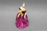 Front and left side view showing the detailed purple gown and yellow shawl