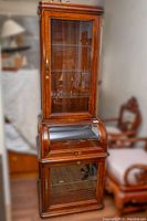 Full front view of the cherrywood display cabinet.