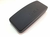 Top angled view of hard glasses case in dark gray with Bolle logo embossed