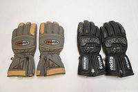 Both pairs of Reusch men's gloves side by side, one leather racing and one fabric skiing