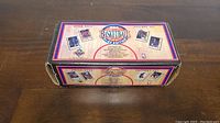 Front and top views of the unopened 1991-92 Upper Deck NBA Basketball Factory Set box showing hologram foil edition and player card images.