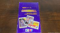Purple box of 1991 O-Pee-Chee Premier Baseball Cards shown from angle, displaying front side with player card images and Major League Baseball logos.