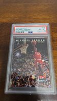 Photo of 1992 Skybox Michael Jordan #38 basketball card graded PSA 6, showing full card front with Michael Jordan dunking and grading label on slab.