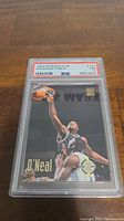 Front view of the 1993 Shaquille O'Neal Stadium Club basketball card graded PSA 6 in protective case.