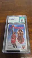 Photo of 1991-92 Upper Deck Michael Jordan basketball card graded 8.5 by CSG, showing front of card and grading label.
