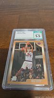Front view of the 1998-99 Vince Carter rookie basketball card graded 5.5 by Certified Sports Guaranty in protective plastic slab.