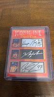 Iconic Ink Triple Cuts card with autograph facsimiles of Wayne Gretzky, Mark Messier, and Connor McDavid, numbered 13 of 99 out of 1000.