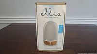 Box front showing product image, Ellia branding and slogan 'Open Your Senses'.