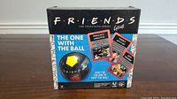 Front of the box showing the Friends logo and the multi-colored ball visible through plastic