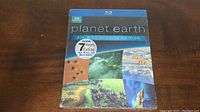 Front cover of the Planet Earth Blu-ray set showing the special edition and visuals of different earth scenes.