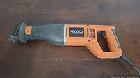 Full side view of RIDGID reciprocating saw showing overall condition and design.