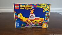 Front of box showing assembled submarine and four minifigures
