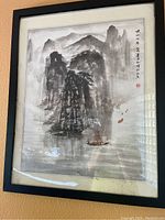 Photo of framed silk watercolor depicting traditional Chinese mountain landscape with calligraphy and a boat on water.