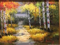 Close-up of the oil painting depicting a fall scene with birch trees and pathway, showing the vibrant colors and artist's signature.