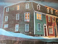 Close-up of the lithograph showing the detailed winter night residential building with snow falling.