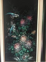 Close-up of original canvas oil painting showing flowers and birds in detail with dark background.