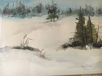 Close-up of the watercolor painting showing winter landscape and artist signature Donnah Cameron at lower right.