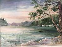Close view of the watercolor painting showing lake, trees, rocks, and sky.